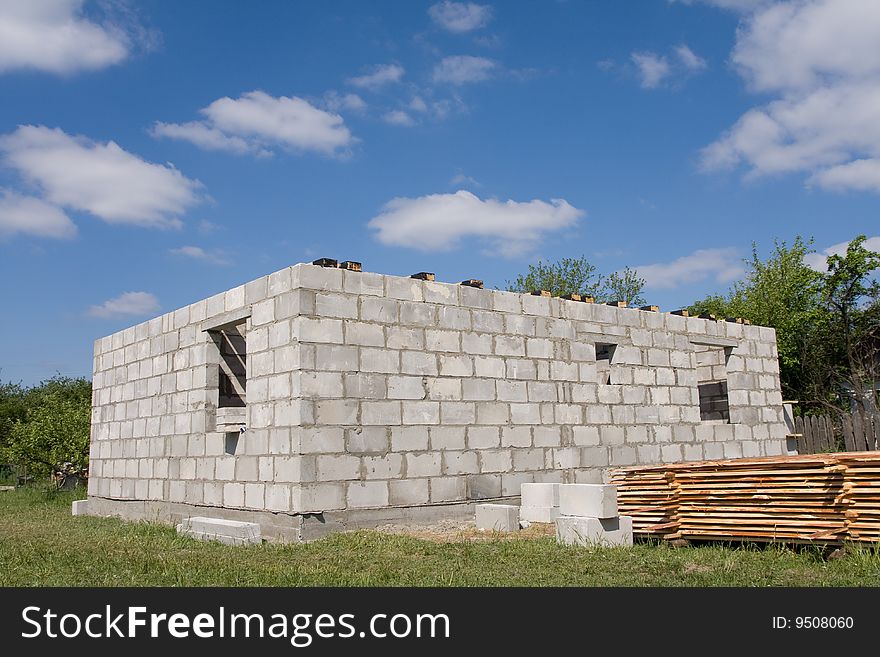 House under construction on a background blue sky