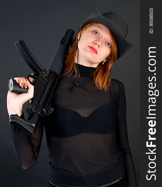 Young woman holding the gun