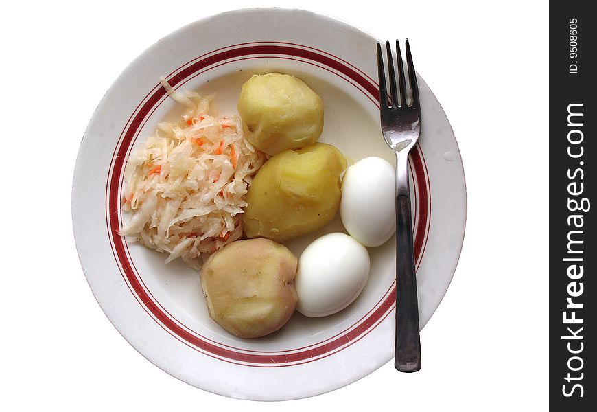 Natural products on a plate. A boiled potato, a sauerkraut and boiled eggs. A healthy food. Natural products on a plate. A boiled potato, a sauerkraut and boiled eggs. A healthy food.
