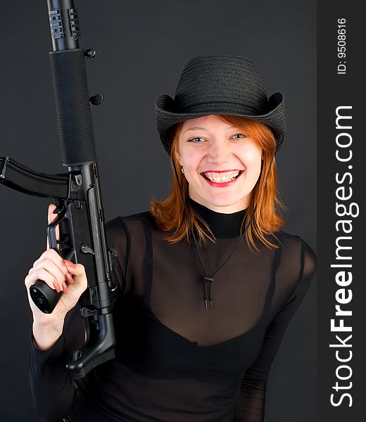 Young woman holding the gun