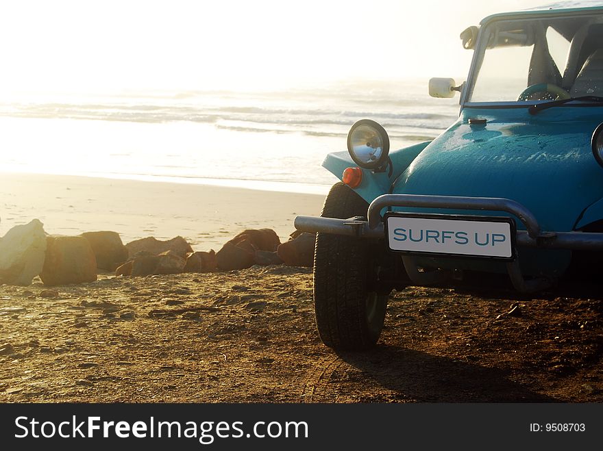 Beach buggie on beach with ocean in background