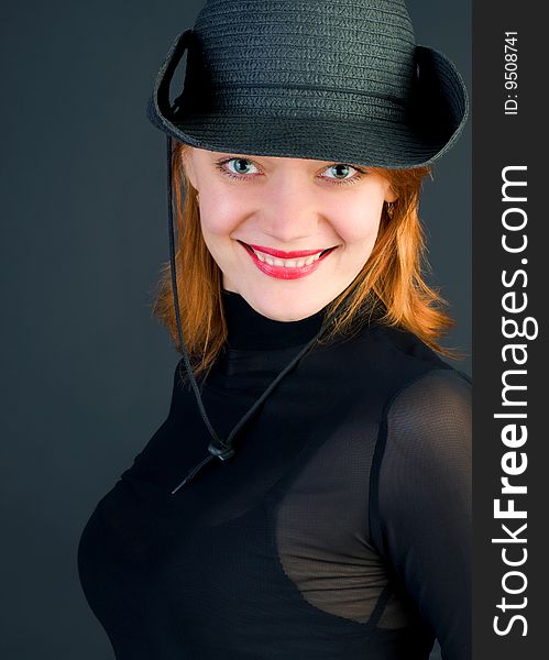 red young woman wearing a cowboy hat. red young woman wearing a cowboy hat