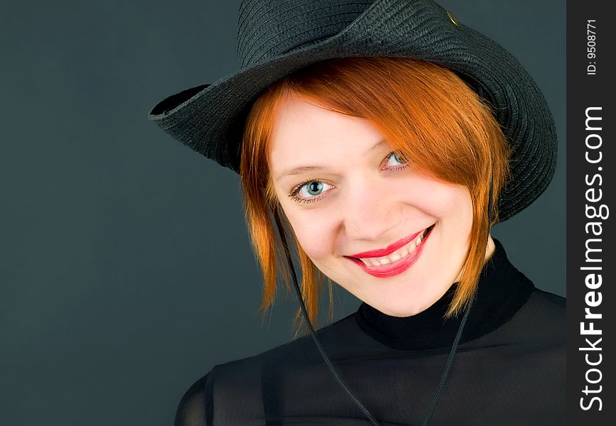 Sexy red young woman wearing a cowboy hat. Sexy red young woman wearing a cowboy hat