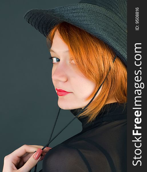 red young woman wearing a cowboy hat. red young woman wearing a cowboy hat