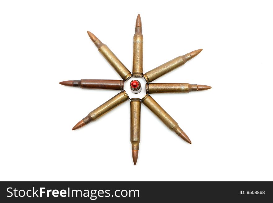 Eight-pointed star made of 5.56mm M16 assault rifle cartridges isolated. Eight-pointed star made of 5.56mm M16 assault rifle cartridges isolated