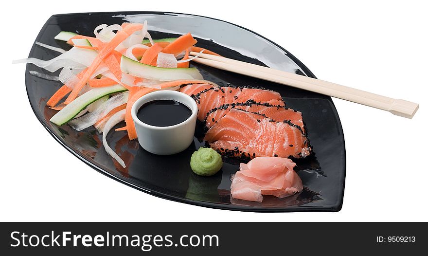 Japanese inspired salmon on a black plate