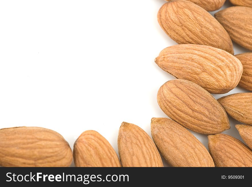 Almond nuts forming a frame, in white background. Almond nuts forming a frame, in white background.