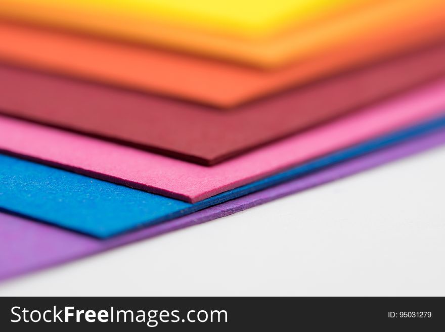 A stack of colorful sheets of paper. A stack of colorful sheets of paper.
