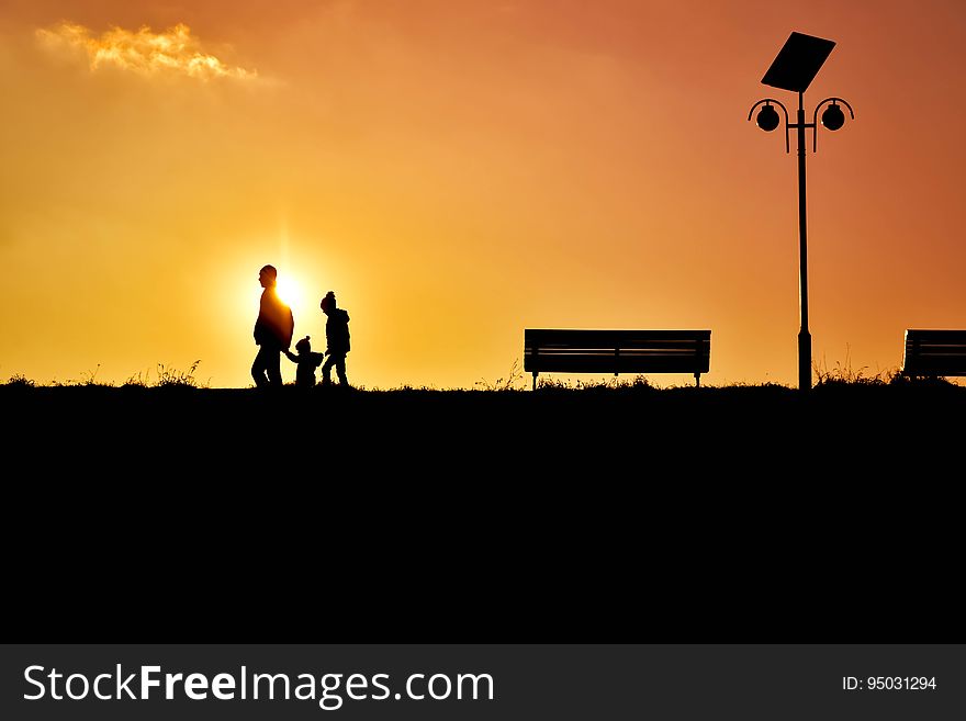 Men Riding Silhouette People On Street Against Sky During Sunset