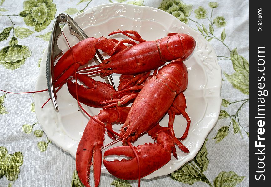 Cooked lobster on a plate waiting to be ate