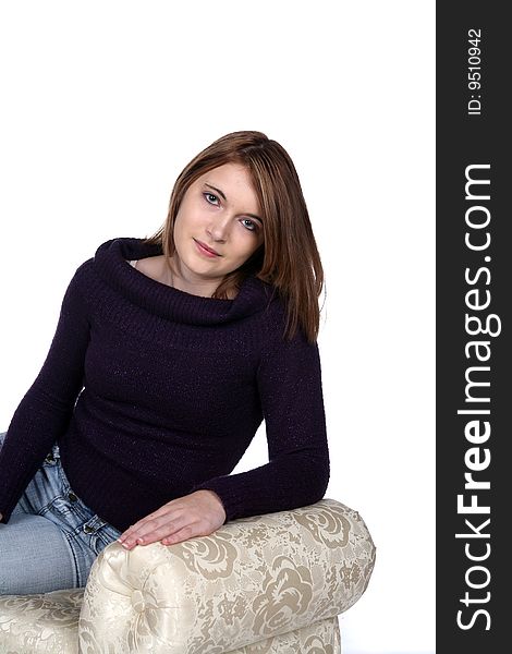 Pretty teen with black sparkling sweater on bench