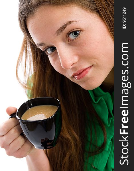 An attractive young woman with a coffee cup in her hands. An attractive young woman with a coffee cup in her hands