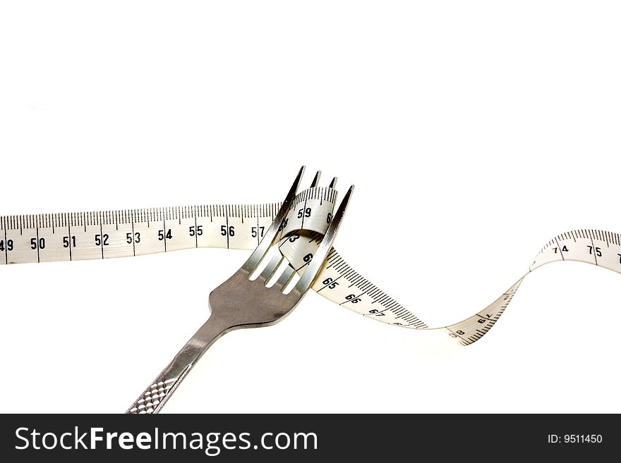 Conceptual image of a fork twirling a measuring tape off of a plate. Conceptual image of a fork twirling a measuring tape off of a plate