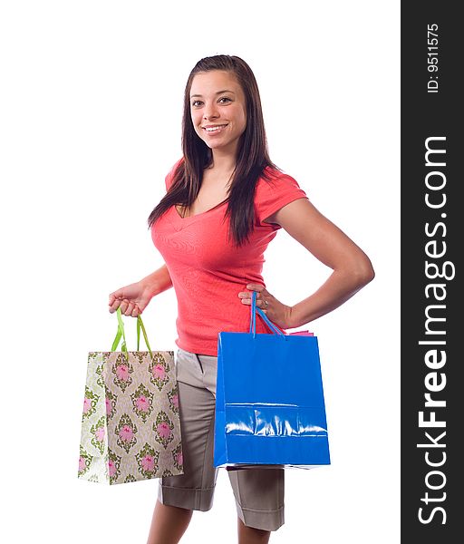 Woman holding shopping bags isolated on white