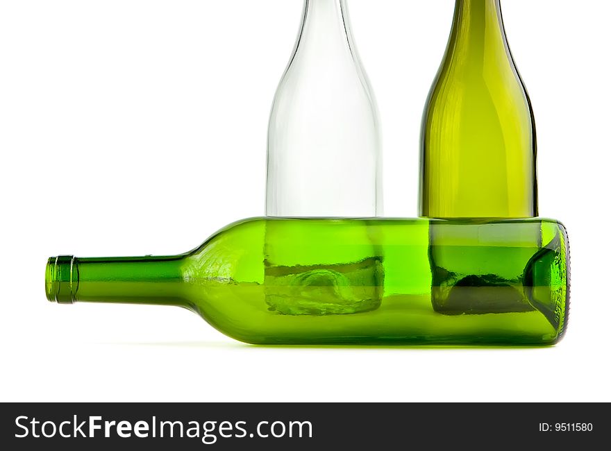 Green empty bottles on white