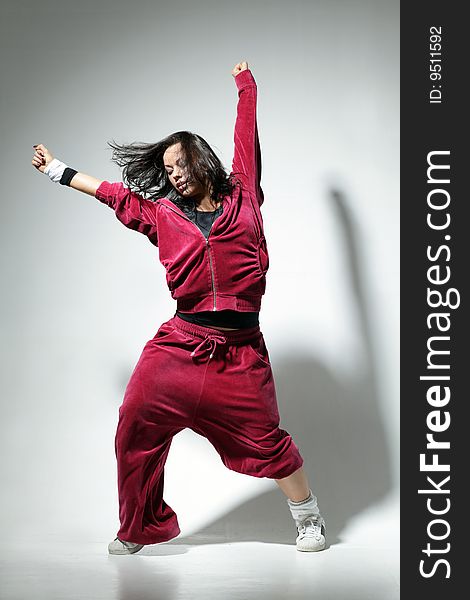 Modern style dancer posing on studio background. Modern style dancer posing on studio background