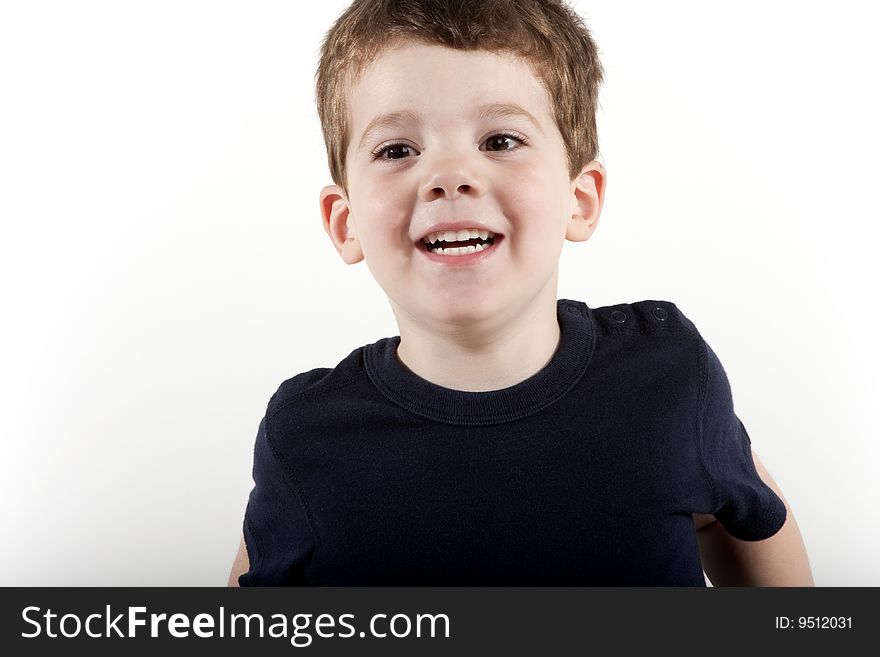 Young preschool age boy smiling and looking happy. Young preschool age boy smiling and looking happy
