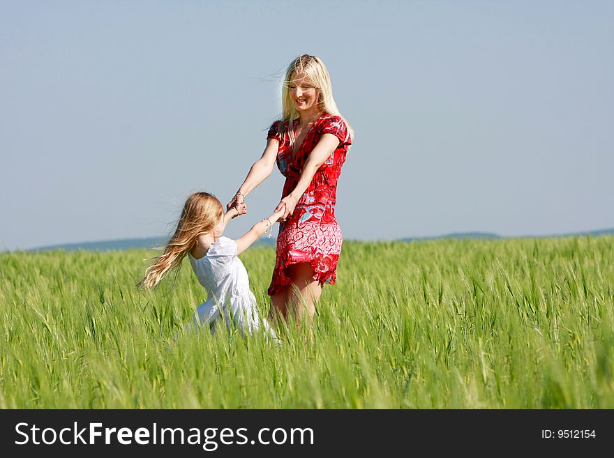 Mother and daughter outdoors