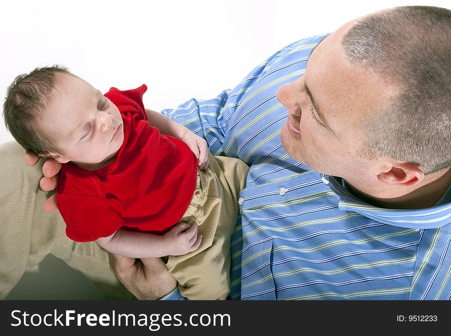 Father holding newborn baby boy in his hands. Father holding newborn baby boy in his hands