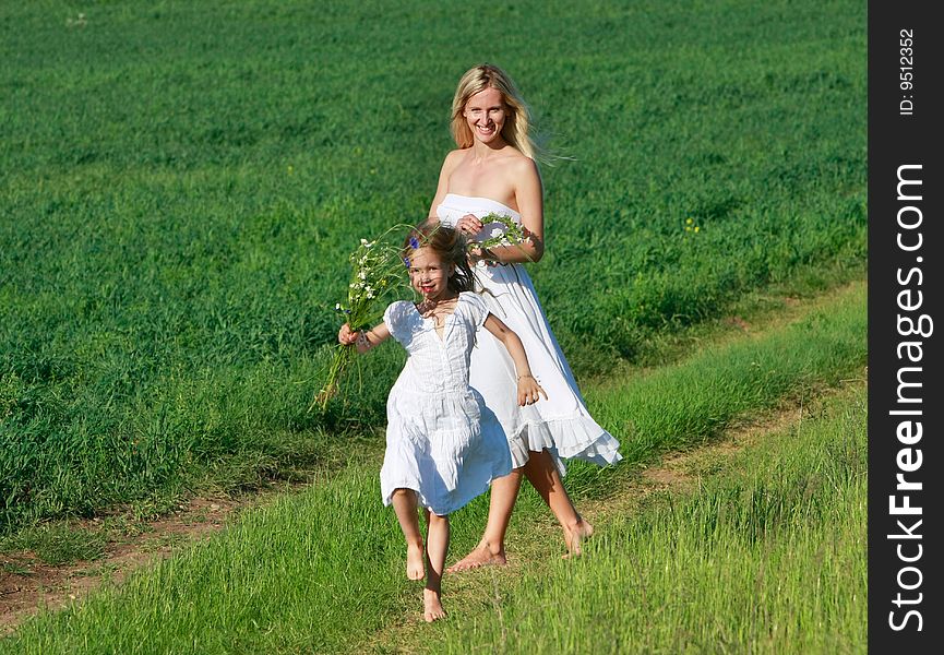 Mother And Daughter On Rural Road