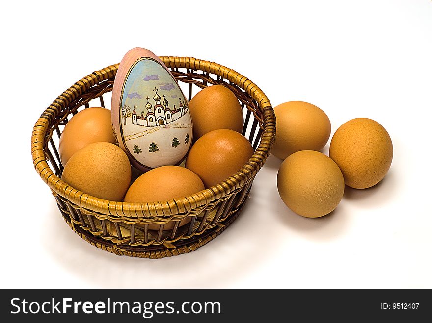 Easter egg in basket on a white