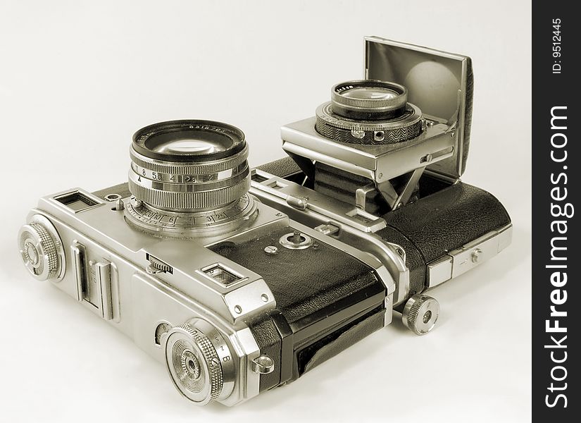 Two antiquarian 35-mm film cameras.