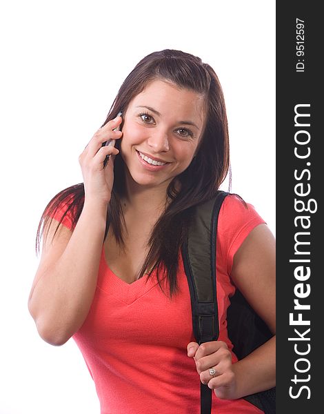 Young woman with a backpack isolated on white