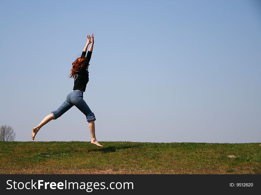 The girl taken in a jump like hanging in the air. The girl taken in a jump like hanging in the air