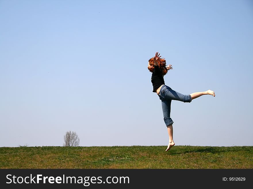 The girl taken in a jump like hanging in the air. The girl taken in a jump like hanging in the air