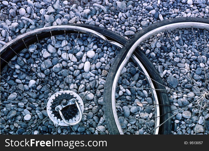 Bent wheel on the gray gravel - photo