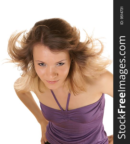 The girl with fluttering hair, is photographed on a white background