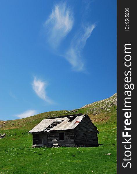 Old Bucegi Mountains shelter in Romania in a sunny may day. Old Bucegi Mountains shelter in Romania in a sunny may day