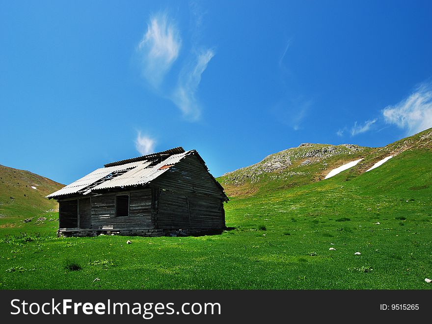 Old Bucegi Mountains shelter in Romania in a sunny may day. Old Bucegi Mountains shelter in Romania in a sunny may day