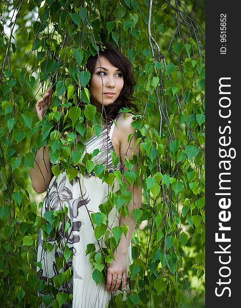 Beautiful girl in a birchwood