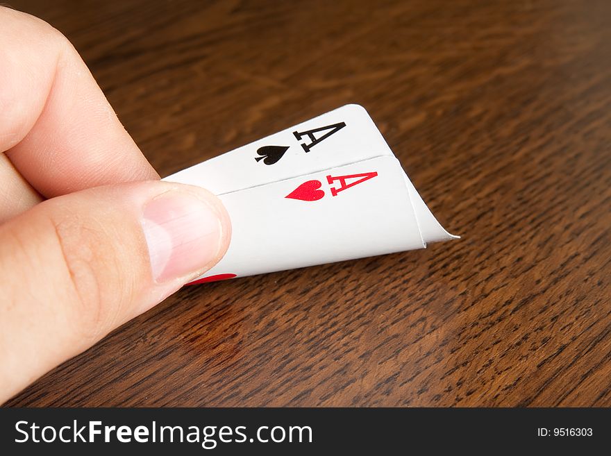 Playing cards in men hand