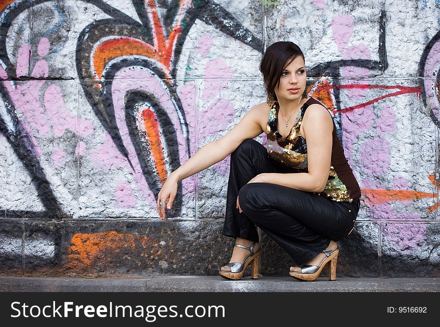 Girl near the wall with graffiti