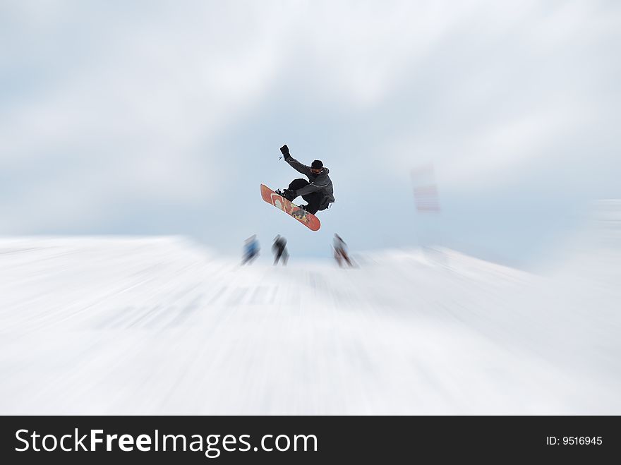 Snownoarder jumping out of half-pipe. Snownoarder jumping out of half-pipe