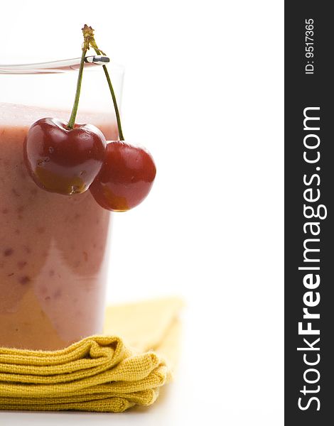 A delicious cherry milkshake isolated over white