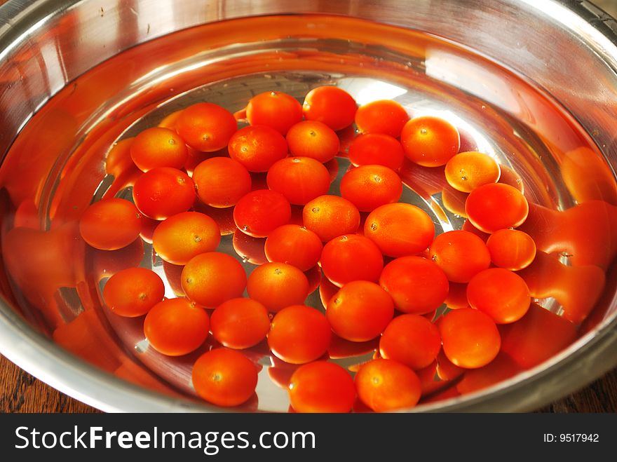 Tomatoes cherry in cold water. Tomatoes cherry in cold water