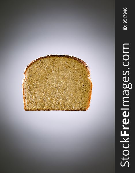 Multigrain bread floating in front of a gray backdrop. Multigrain bread floating in front of a gray backdrop.