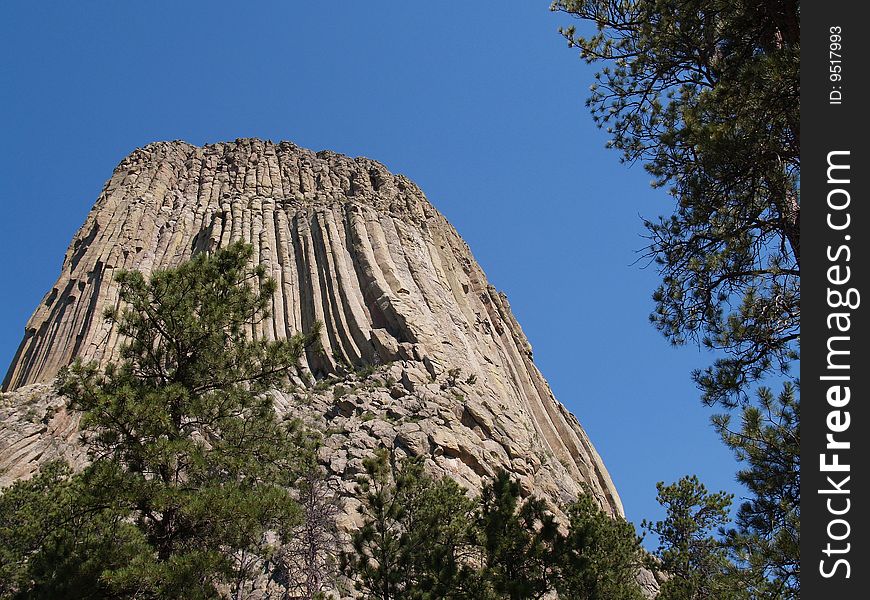 Devil's Tower, a rising monolithic rock, in Devil's Tower National Monument, Wyoming (USA). Devil's Tower, a rising monolithic rock, in Devil's Tower National Monument, Wyoming (USA).