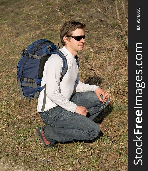 Young man with rucksack and sun glasses. Young man with rucksack and sun glasses