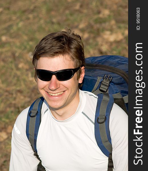Young man with rucksack and sun glasses. Young man with rucksack and sun glasses