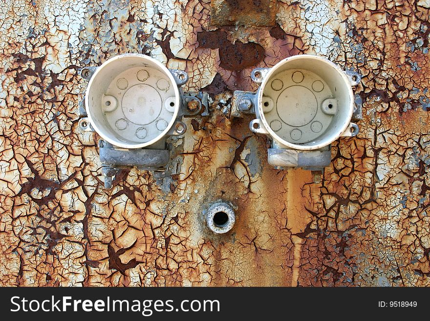 An abstract picture of eroded cracked old paint on metal surface on board. An abstract picture of eroded cracked old paint on metal surface on board