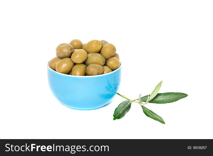 Blue cup full of green olives