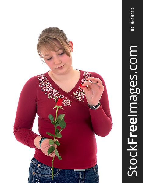 Casual dressed teenager, holding rose flower . studio shot. Casual dressed teenager, holding rose flower . studio shot.