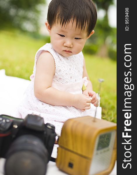 Portrait Of A Infant Girl Outdoor In The Park