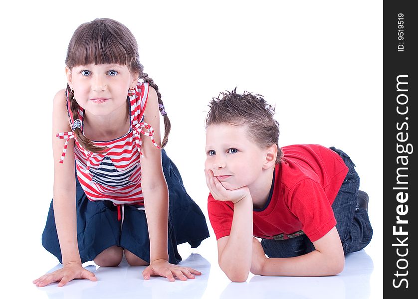 Cute Blue-eyed Boy And Girl Posing In The Studio