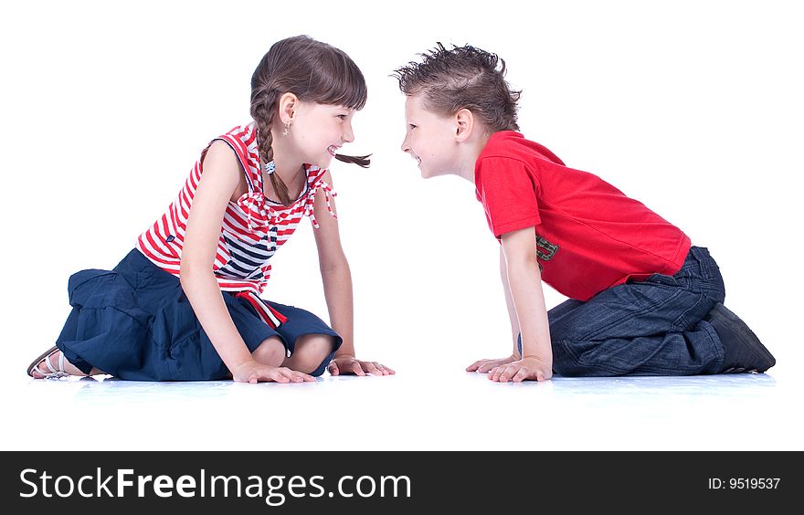 Cute Blue-eyed Boy And Girl Are Playing