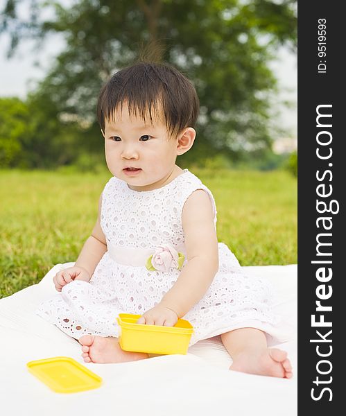 Portrait of a infant girl outdoor in the park